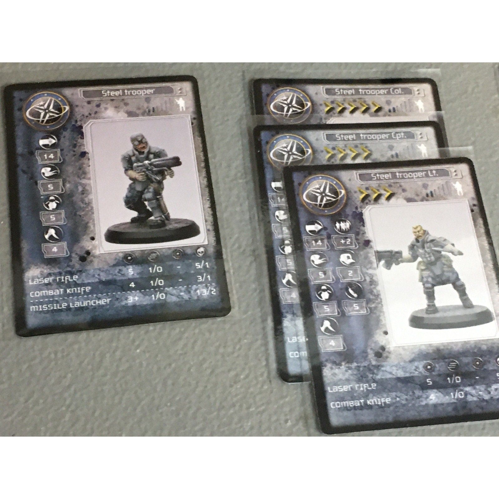 A33529 RACKHAM AT-43 UNA STEEL TROOPERS 7 PK MINIATURES W CARDS